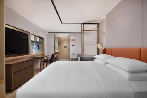 Imagen de la habitación del Hotel Home2 Suites by Hilton Guangzhou Baiyun Airport West. Foto 8