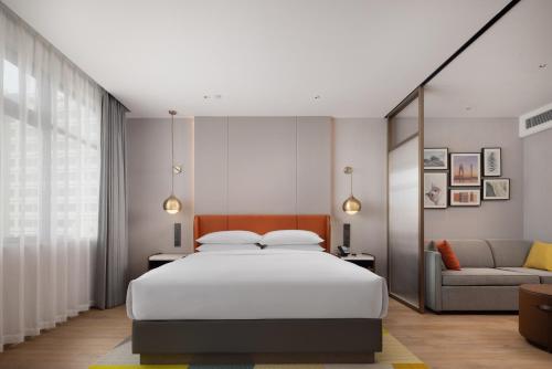 Imagen de la habitación del Hotel Home2 Suites by Hilton Guangzhou Baiyun Airport West. Foto 10