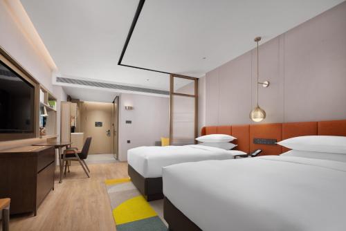 Imagen de la habitación del Hotel Home2 Suites by Hilton Guangzhou Baiyun Airport West. Foto 13
