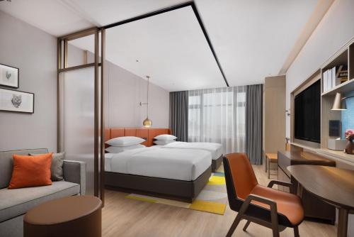 Imagen de la habitación del Hotel Home2 Suites by Hilton Guangzhou Baiyun Airport West. Foto 14