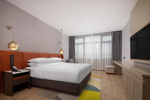Imagen de la habitación del Hotel Home2 Suites by Hilton Guangzhou Baiyun Airport West. Foto 17