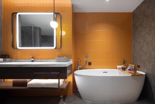 Imagen de la habitación del Hotel Home2 Suites by Hilton Guangzhou Baiyun Airport West. Foto 19