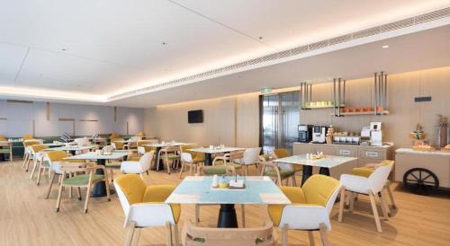 Imagen del bar/restaurante del Hotel Home2 Suites by Hilton Guangzhou Conghua. Foto 15