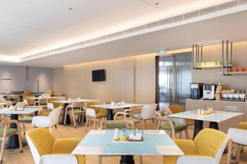 Imagen del bar/restaurante del Hotel Home2 Suites by Hilton Guangzhou Conghua. Foto 17