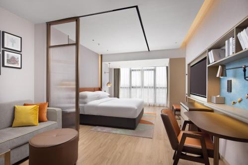 Imagen de la habitación del Hotel Home2 Suites by Hilton Nanning. Foto 11