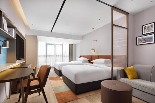 Imagen de la habitación del Hotel Home2 Suites by Hilton Nanning. Foto 12