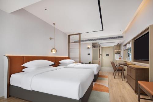 Imagen de la habitación del Hotel Home2 Suites by Hilton Nanning. Foto 13