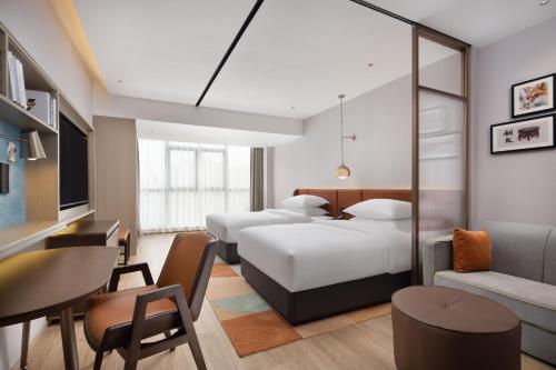 Imagen de la habitación del Hotel Home2 Suites by Hilton Nanning. Foto 14