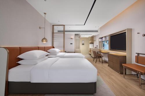 Imagen de la habitación del Hotel Home2 Suites by Hilton Nanning. Foto 15