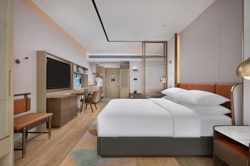 Imagen de la habitación del Hotel Home2 Suites by Hilton Nanning. Foto 16