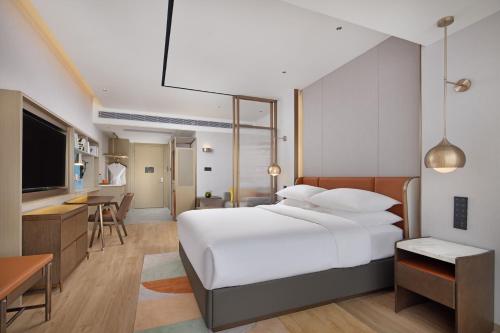 Imagen de la habitación del Hotel Home2 Suites by Hilton Nanning. Foto 18