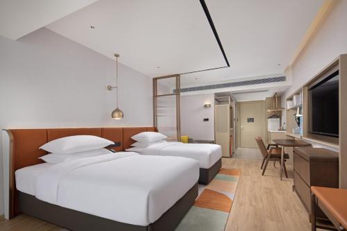 Imagen de la habitación del Hotel Home2 Suites by Hilton Nanning. Foto 19