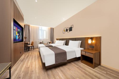 Imagen de la habitación del Hotel HomeInn Selection Harbin Central Street Sophia Church. Foto 19