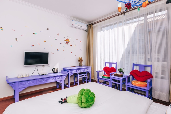 Imagen de la habitación del Hotel Homelife Theme Inn Dali. Foto 2