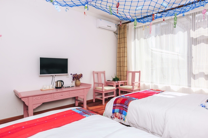 Imagen de la habitación del Hotel Homelife Theme Inn Dali. Foto 3