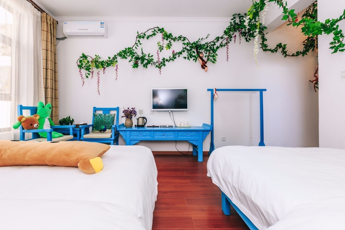 Imagen de la habitación del Hotel Homelife Theme Inn Dali. Foto 4