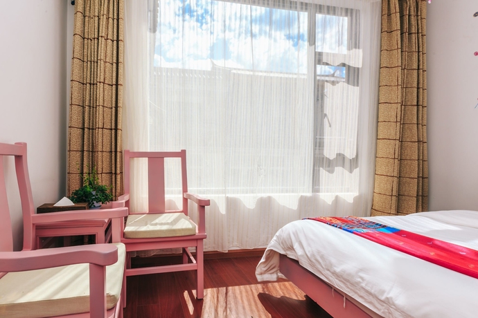 Imagen de la habitación del Hotel Homelife Theme Inn Dali. Foto 5