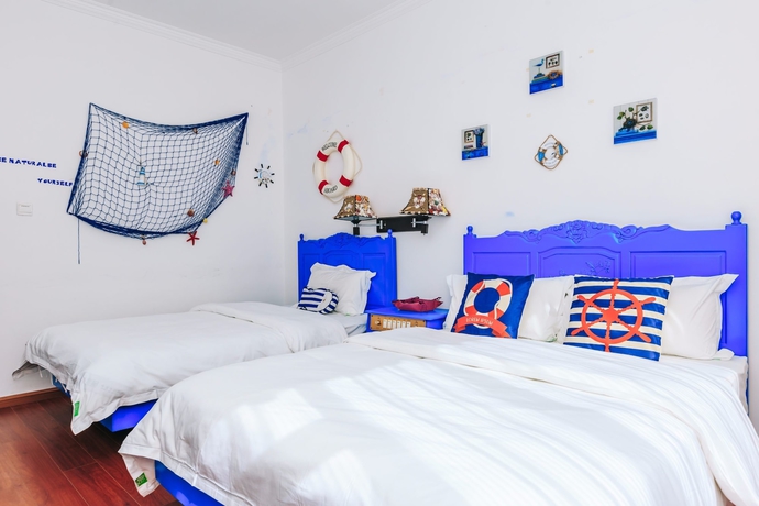 Imagen de la habitación del Hotel Homelife Theme Inn Dali. Foto 9