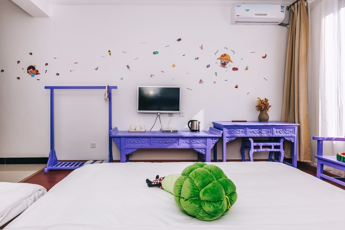 Imagen de la habitación del Hotel Homelife Theme Inn Dali. Foto 11