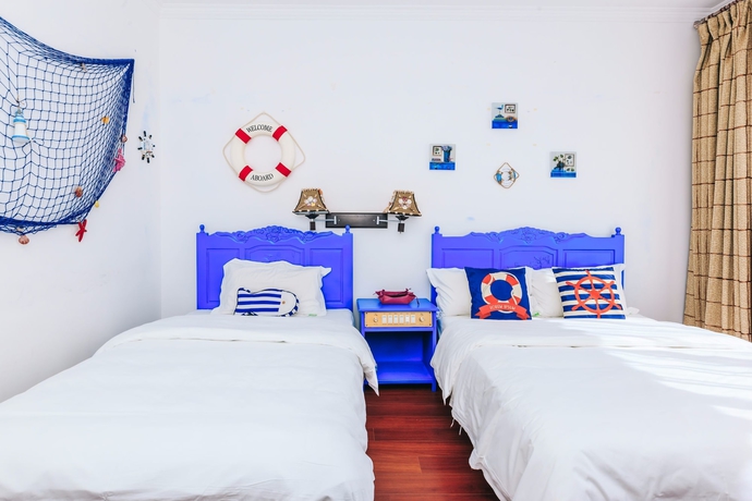 Imagen de la habitación del Hotel Homelife Theme Inn Dali. Foto 13