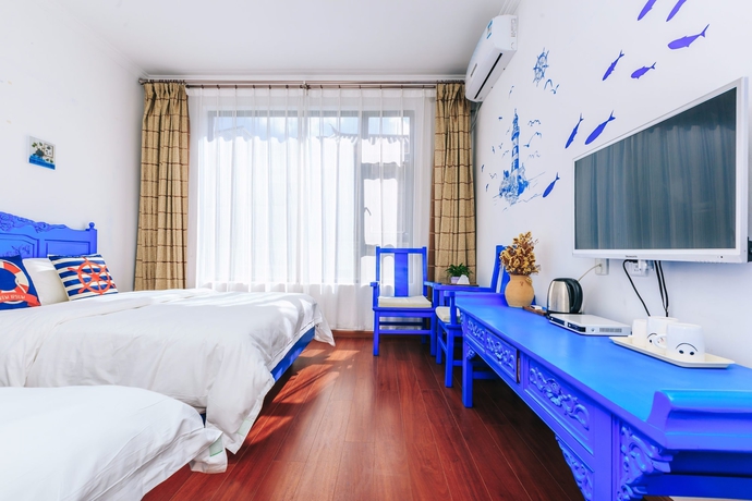 Imagen de la habitación del Hotel Homelife Theme Inn Dali. Foto 15