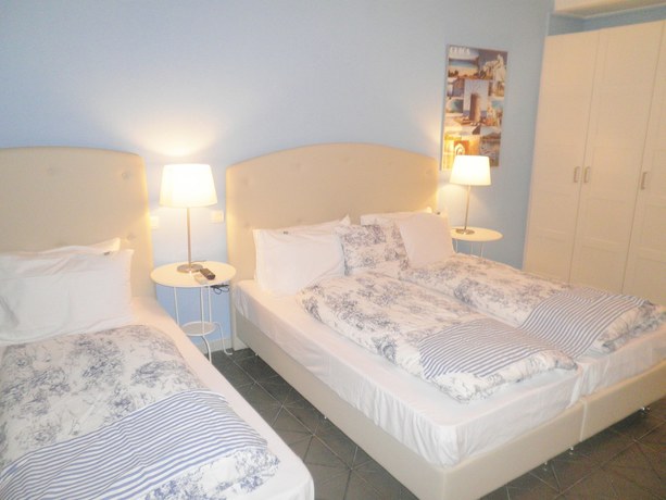 Imagen de la habitación del Hotel Homely Studios. Foto 7