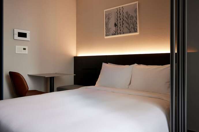 Imagen de la habitación del Hotel Homes Stay Myeongdong. Foto 17