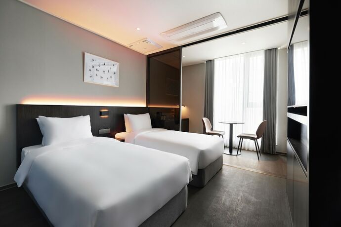 Imagen de la habitación del Hotel Homes Stay Myeongdong. Foto 18