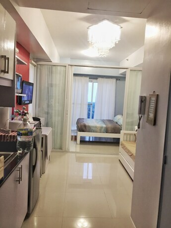 Imagen de la habitación del Hotel Homestay At Wind Residences. Foto 25