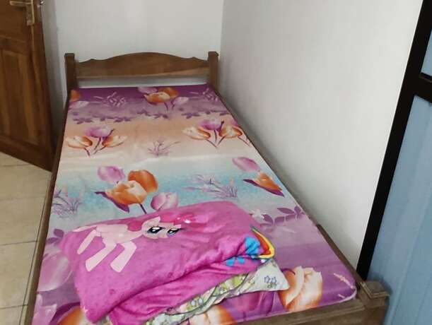 Imagen de la habitación del Hotel Homestay Sudiono. Foto 13