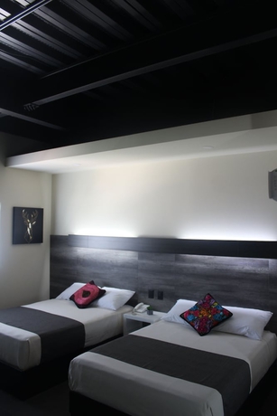 Imagen de la habitación del Hotel Homesuites Malecon. Foto 2