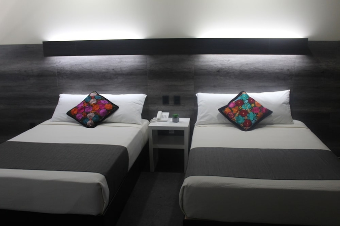 Imagen de la habitación del Hotel Homesuites Malecon. Foto 3