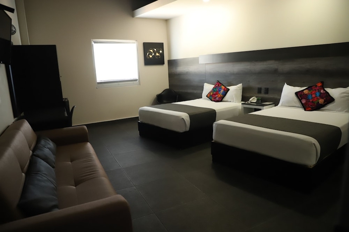 Imagen de la habitación del Hotel Homesuites Malecon. Foto 4