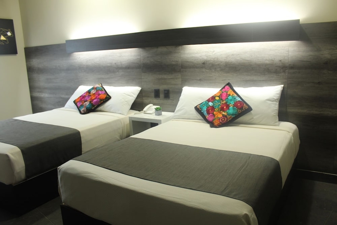 Imagen de la habitación del Hotel Homesuites Malecon. Foto 5