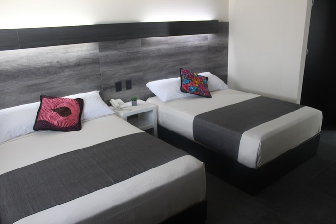 Imagen de la habitación del Hotel Homesuites Malecon. Foto 7
