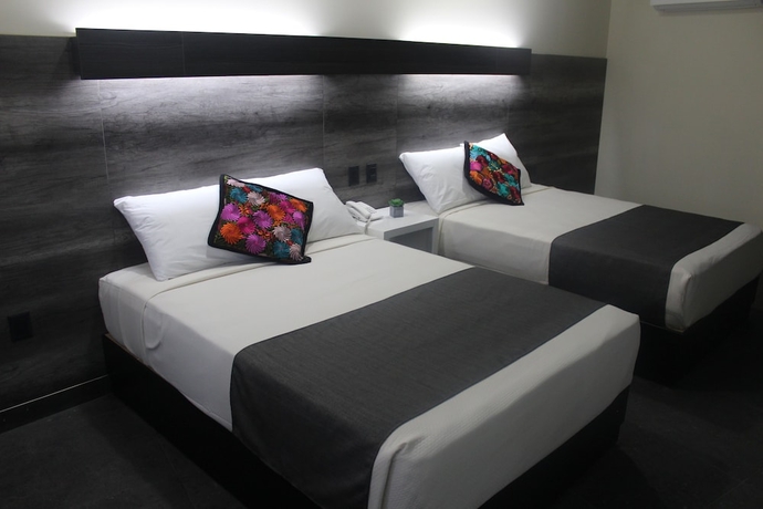 Imagen de la habitación del Hotel Homesuites Malecon. Foto 9