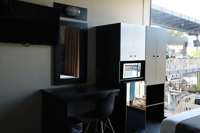 Imagen de la habitación del Hotel Homesuites Malecon. Foto 11