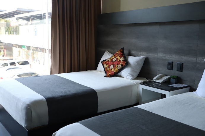 Imagen de la habitación del Hotel Homesuites Malecon. Foto 12