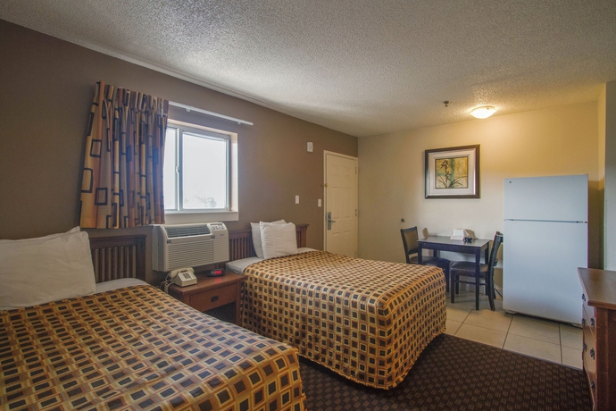 Imagen de la habitación del Hotel Hometowne Studios By Red Roof Orlando South. Foto 10