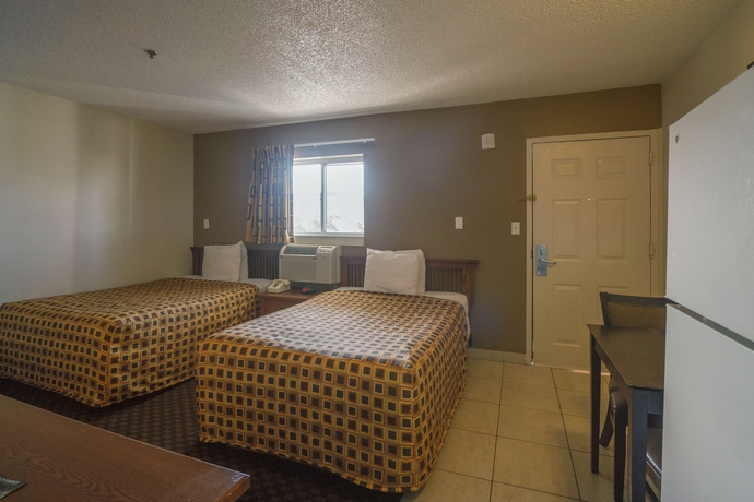 Imagen de la habitación del Hotel Hometowne Studios By Red Roof Orlando South. Foto 14
