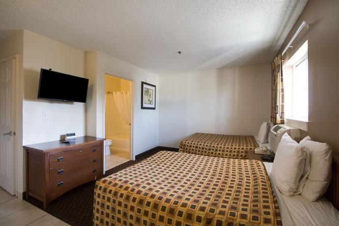 Imagen de la habitación del Hotel Hometowne Studios By Red Roof Orlando South. Foto 15