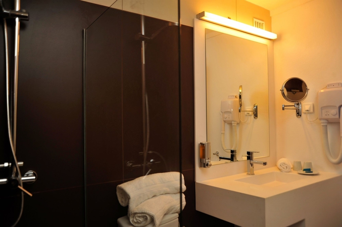 Imagen de la habitación del Hotel Hommage and Residences. Foto 9