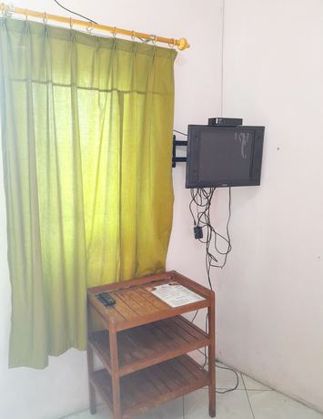 Imagen de la habitación del Hotel Homy House Semarang. Foto 6