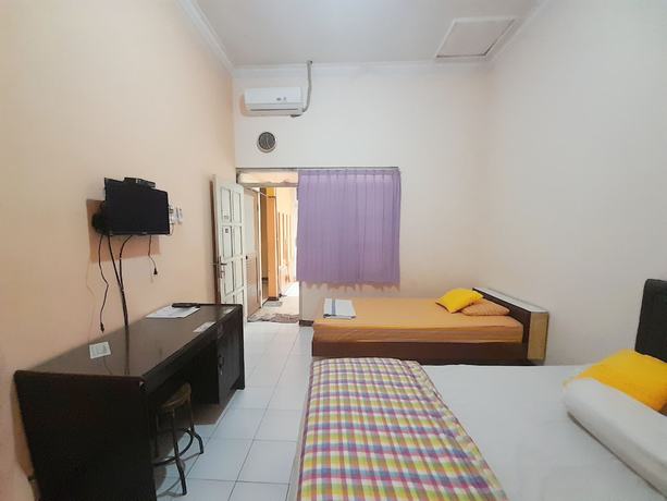 Imagen de la habitación del Hotel Homy House Semarang. Foto 7
