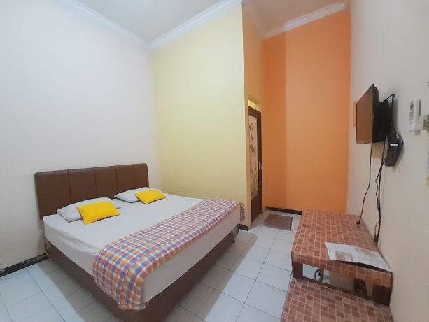 Imagen de la habitación del Hotel Homy House Semarang. Foto 8