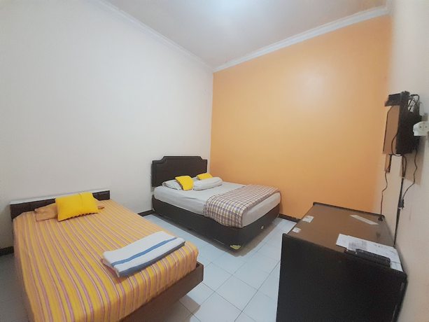 Imagen de la habitación del Hotel Homy House Semarang. Foto 9