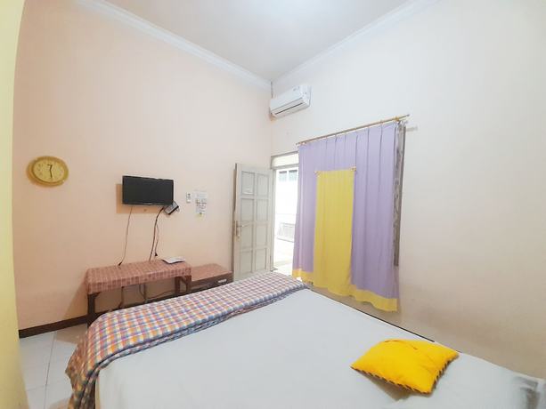 Imagen de la habitación del Hotel Homy House Semarang. Foto 10