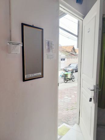 Imagen de la habitación del Hotel Homy House Semarang. Foto 11