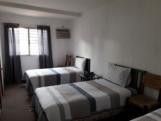 Imagen de la habitación del Hotel Honduras Executive Inn at Palmira. Foto 9