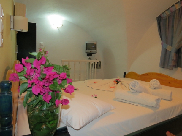 Imagen de la habitación del Hotel Honeymoon Beach Studios. Foto 5